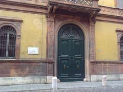 Main entrance of Palazzo Gulinelli with Ettore Bugatti commemorative plate in Ferrara Italy