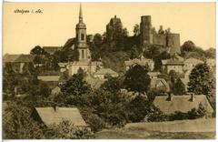 Historic Stolpen Castle and Church with surrounding buildings and trees