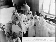 Norman Bethune assisting Dr. Edward Archibald during an operation at Royal Victoria Hospital in 1933