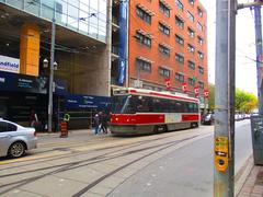 Queen streetcar passing near St. Mike's in Toronto