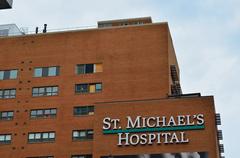 St. Michael's Hospital building in Toronto with urban skyline