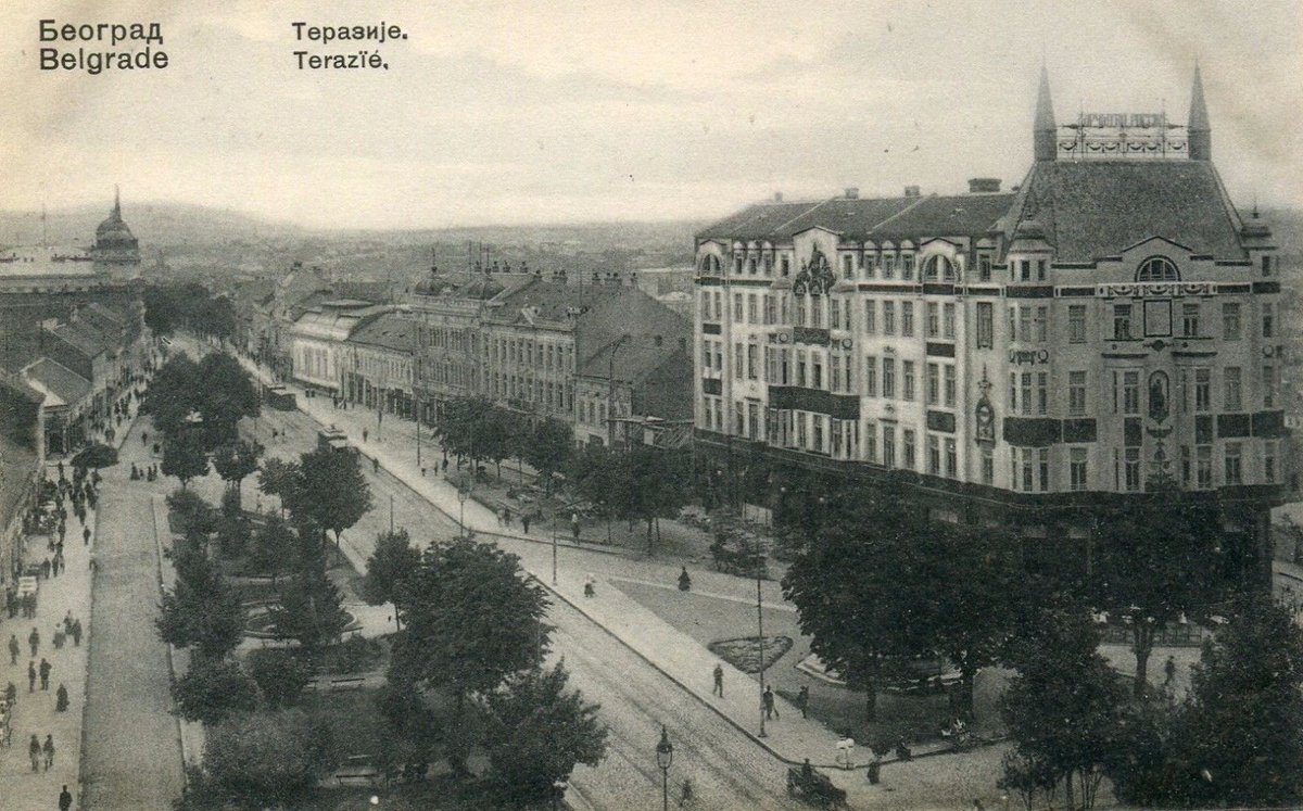 Old black and white photo of Terazije square in Belgrade with historic buildings and street activity