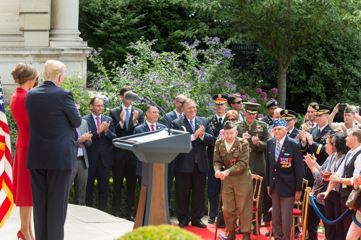 President Donald J. Trump and First Lady Melania Trump posing with World War II veterans on July 13, 2017