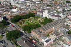 Aerial photograph of Jackson Square in New Orleans, Louisiana showing the park, surrounding buildings, and Mississippi River