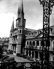 View of St. Louis Cathedral, Cabildo, and Presbytere buildings along Chartres Street in New Orleans from Lower Pontalba Building balcony in 1937