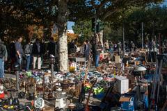 Flea market on the Museumsufer in Frankfurt am Main with various stalls and people shopping