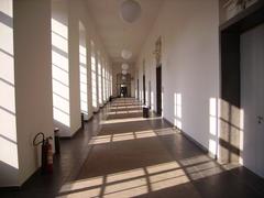 Interior long corridor hallway with arches and intricate ceiling at Mannheim Castle Germany