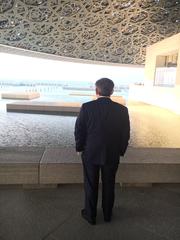 Visitor exploring contemporary art at the Louvre Abu Dhabi