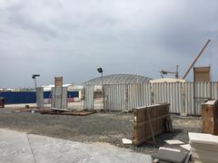 The Louvre at Saadiyat Island under construction with cranes and building structures