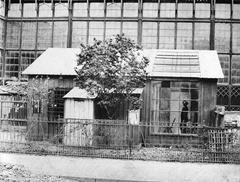 Wooden house with artist studio in front of the glass palace in Munich