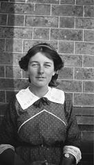 Portrait of Doris McKellar in front of a brick wall