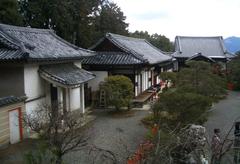 Kenkun Shrine entrance with traditional red torii gate and stone lanterns