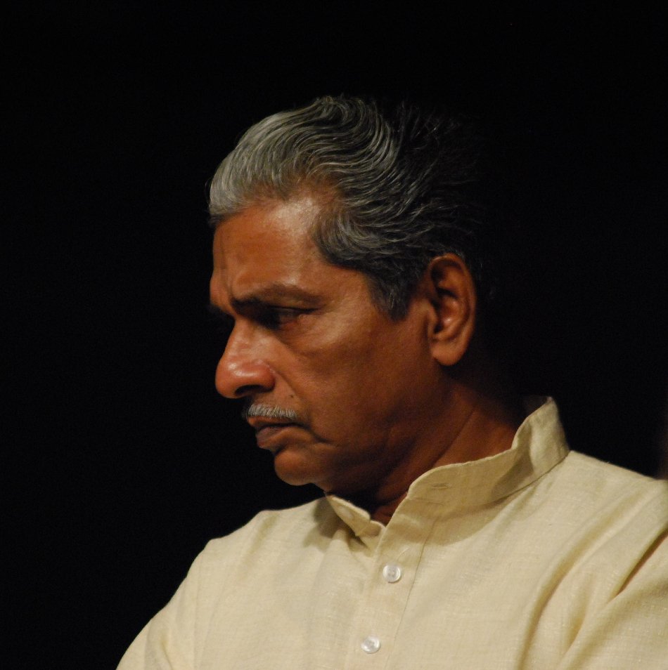 Portrait of Dr. K.G. Poulose in formal attire