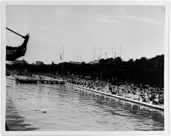 Waterfront area in front of Vietnamese Navy headquarters with radio masts during 1956 Republic of Vietnam anniversary celebration