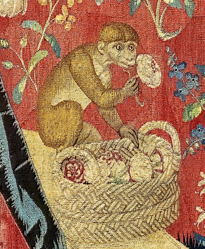 Medieval tapestry depicting a monkey from La Dame à la Licorne series at Musée de Cluny in Paris