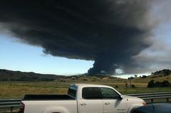 Plume of black smoke rising from fire at Macro Plastics factory in Fairfield viewed from Interstate 80