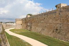 Castle of Otranto in Italy with historic stone walls and towers under a clear blue sky