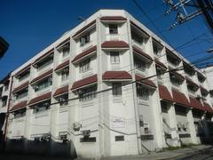 Intramuros landmarks including Associated Marine Officers and Seamen's Union of the Philippines (AMOSUP) building with Filipino Seafarer sculpture in Manila