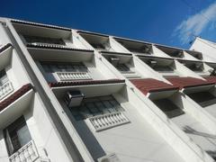 Intramuros landmarks in Manila featuring Associated Marine Officers and Seamen's Union of the Philippines building and Filipino Seafarer sculpture