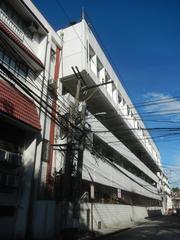 View of Intramuros landmarks in Manila including AMOSUP - MAAP Professional Career Development Center and Filipino Seafarer sculpture along General Luna Street