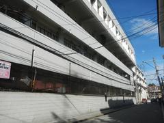 Intramuros landmarks in Manila featuring Filipino Seafarer sculpture and AMOSUP Seamen's Center