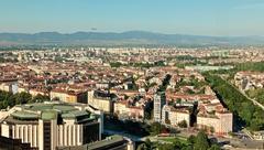 Plane approaching Sofia airport for landing over city landscape