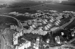 Aerial view of Kiryat Shmona cityscape with buildings and greenery