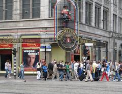 Interior view of Madame Tussauds wax museum in Amsterdam with wax figures and visitors