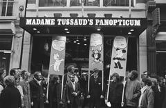 Black and white photograph of a demonstration featuring comic strip characters in Kalverstraat, Amsterdam on April 17, 1971