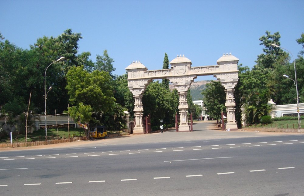 Mku Entrance Building with Blue Staircase and Signboard