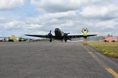 Retired Col. Gail Halvorsen arrives in a C-47 airplane for Berlin Airlift 70th anniversary celebration