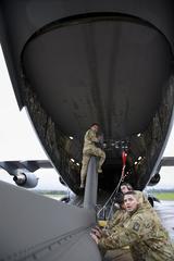 Soldiers from 12th Combat Aviation Brigade preparing AH-64D Longbow helicopters for transport on U.S. Air Force C-17 aircraft at Wiesbaden Army Airfield