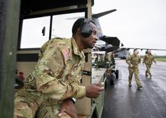 Soldiers loading AH-64D Longbow helicopters onto USAF C-17 at Wiesbaden Army Airfield