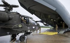Soldiers loading AH-64D Longbow helicopters onto U.S. Air Force C-17 at Wiesbaden Army Airfield