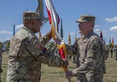 Gen. Darryl Williams receiving the colors from Gen. Tod D. Wolters during USAREUR-AF Change of Command Ceremony