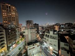 Cityscape view from the 6th floor of Maison Franco-Japonaise overlooking modern buildings in Tokyo