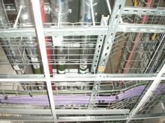 Intricate network of wires and pipes on a ceiling