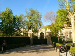 Entrance to the Palacio de Liria in Madrid with ornate wrought iron gates and stone pillars