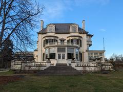 Spadina House historic mansion surrounded by winter trees and snow