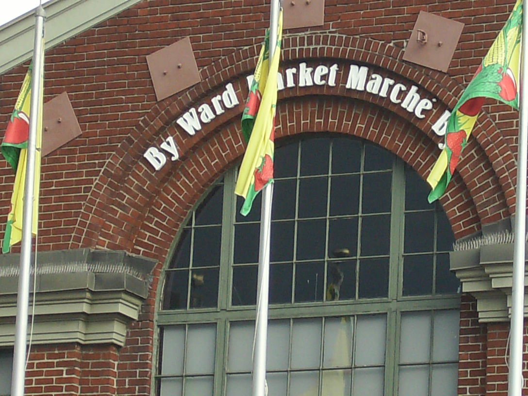 View of By Ward Market in Ottawa with historic buildings and outdoor market stalls