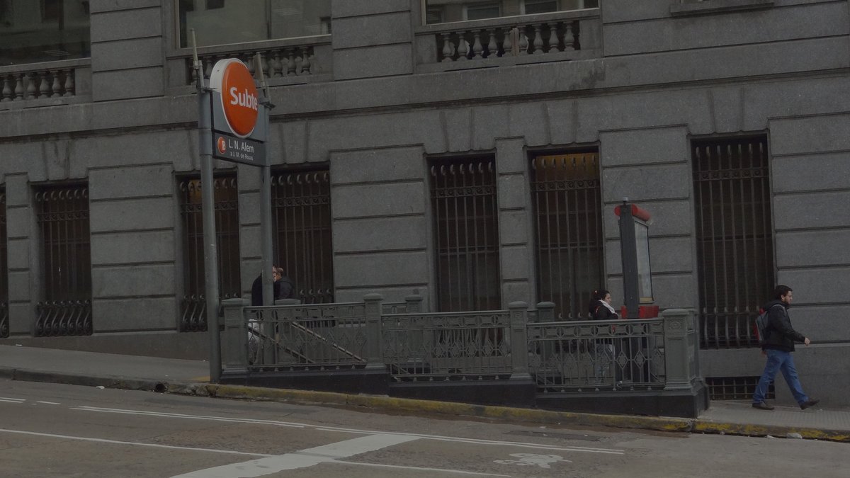 Entrance to Alem metro station in Buenos Aires with escalators and subway sign