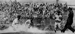 Hollywood Stars second baseman Ham Schulte attempting to steal a base during 1942 baseball game against Los Angeles Angels at Wrigley Field, California