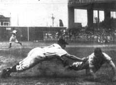 Los Angeles Angels third baseman Lee Handley tagging out San Diego Padres baserunner Steve Mesner during 1949 baseball game at Wrigley Field Los Angeles