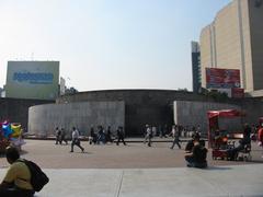 Outside entrance of Metro Insurgentes in Mexico City with street view and people walking