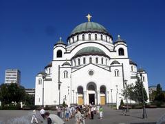 Slovenians admiring the Church of Saint Sava near the fountain