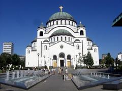 Slovenians enjoying the view near the unfinished Church of Saint Sava by the fountain