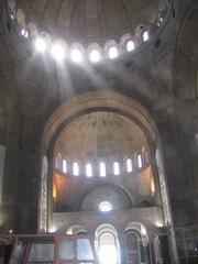 Sunbeams shining through the openings of an unfinished dome