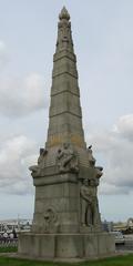 Memorial to the Engine Room Heroes in Liverpool with plaques under a curved roof structure