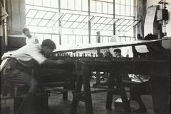 Interior of a factory in Shien Chiao, China, vintage black and white photo from 1934-1939 showing industrial machinery and workers