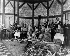 Vintage photo of the troupe 'Veillées du bon vieux temps' in costumes at a corn husking event in 1930